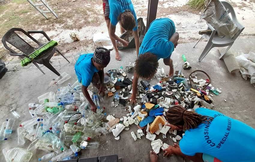 Staff sorting through the trash collected on a single days cleanup