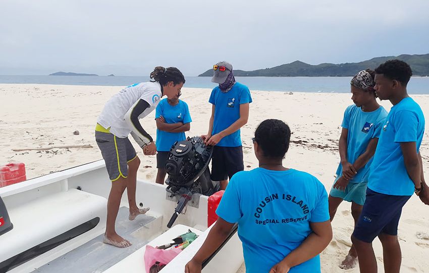 Yves learning how to maintain a boat on Cousin Island